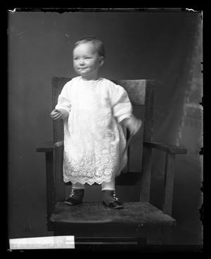 Primary view of object titled '[Baby Standing on Chair]'.