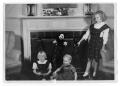 Photograph: [Three Children by Fireplace]