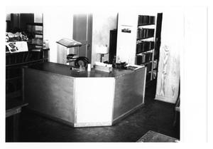 Primary view of object titled '[Desk Inside Public Library]'.