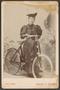 Photograph: [Photograph of Woman With a Bicycle]