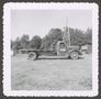 Primary view of [Flatbed Truck Parked Near Derrick]