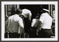 Thumbnail image of item number 1 in: '[Four Paramedics at the Back of an Ambulance]'.