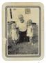 Photograph: [Photograph of a Man Posing with Two Children]