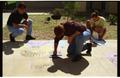 Photograph: [Individuals creating sidewalk chalk art at PACfest]