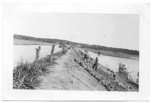 Primary view of object titled '[Placing Riprap on Fishtrap Road]'.