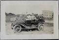 Photograph: [Group of seven people in a motor car on Simmons College campus]