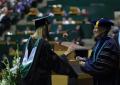 Primary view of [Student at Masters Commencement Ceremony]