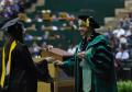 Thumbnail image of item number 1 in: '[Student at Masters Commencement Ceremony]'.