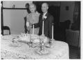 Photograph: Unidentified couple cutting cake