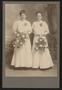 Photograph: [Portrait of Two Unknown Women with Flower Bouquets]