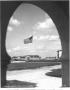 Photograph: View of Flagpole from Archway of PX