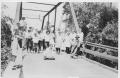 Photograph: Group of People on a Bridge