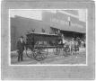 Primary view of J.P. Crouch with Hearse, at C. R. Ritenour, Livery, Feed & Sale Store