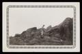 Photograph: [Soldier Climbing Rocky Hill #2]