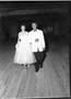 Photograph: [Couple Walking During Pageant]
