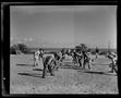 Photograph: [Military Service Members Playing Football at Okinawa Officers Club a…