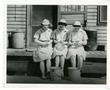 Photograph: [Members of the Women's Auxiliary Corps Peeling Potatoes]