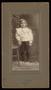 Photograph: [Portrait of an Unknown Child Next to a Chair]