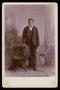 Photograph: [Portrait of an Unknown Young Man Next to a Chair]