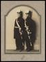Photograph: [Two Men in Uniform with Hats #2]