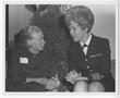 Primary view of [Catherine Freeman Nimitz Sits with Captain Robin Quigley]