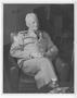 Primary view of [Admiral Chester W. Nimitz Sits in Armchair]