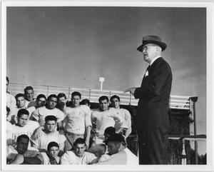 Primary view of object titled '[North Texas President W. J. McConnell addresses football team during Homecoming, 1941]'.