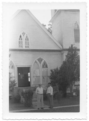 Primary view of object titled '[Two Men in Front of a Church in Gonzales, Texas]'.