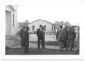 Photograph: [Men Visiting Outside of Church after Meeting]