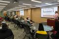 Photograph: [Attendees Watching Mark Phillips Present at the Portal Two Million I…