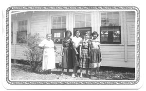 Primary view of object titled '[Group of  Teachers Standing in Front of a Sunday School Building]'.