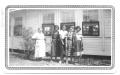 Thumbnail image of item number 1 in: '[Group of  Teachers Standing in Front of a Sunday School Building]'.