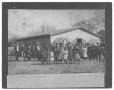 Photograph: [Large Congregation in Front of a Wood-Slatted Church]