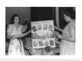 Thumbnail image of item number 1 in: '[Two Women Holding a Poster]'.