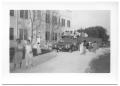 Thumbnail image of item number 1 in: '[Truck Full of People Parked in Front of a School Building]'.