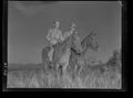 Photograph: [Negative of Two Soldiers on Horseback]