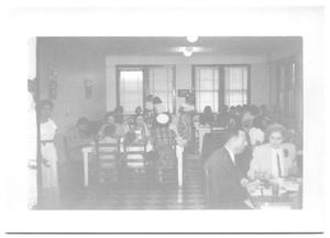 Primary view of object titled '[Room of People Dining]'.