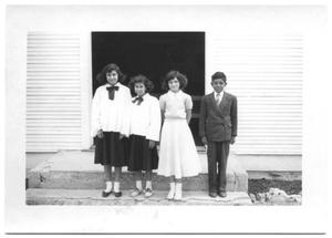 Primary view of object titled '[Four Hispanic Children Dressed Formally]'.