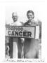 Photograph: [Couple Standing with a Tropico Cancer Sign]