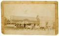 Photograph: [Photograph of a Parade in Front of John Klaerner's Saloon]