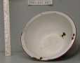 Primary view of Red and white enamel ware mixing bowl.
