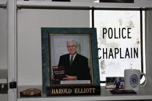 Primary view of object titled '[Image of items recognizing Chaplain Harold Elliott, founder of the Arlington Police Museum]'.