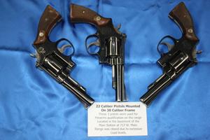 Primary view of object titled '[Image of three pistols used for APD firearms training, 1950s-1970s]'.