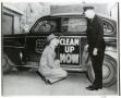 Primary view of [Arlington Police Commissioner Joe Elder and Fire Chief Mike Thompson, 1948, "Clean Up Now" campaign, date on photo]