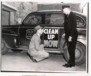 Primary view of object titled '[Arlington Police Commissioner Joe Elder and Fire Chief Mike Thompson, 1948, "Clean Up Now" campaign, name and date on photo]'.