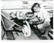 Photograph: [Arlington Police Detective Bob Parsons dusting for prints, 1965]