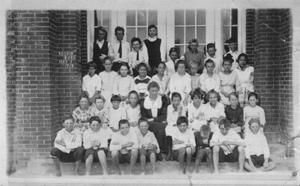 Primary view of object titled '[Rosenberg Public School students in front of closed doors]'.