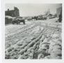 Photograph: [Round Rock street scene with snow & buggies]