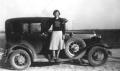 Primary view of [Frances McNeese Archer standing with car]