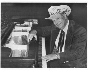 Primary view of object titled '[Autographed photo of Al Stricklin at the piano]'.